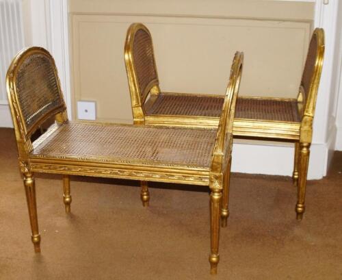 A pair of early 20thC gilt gesso window seats