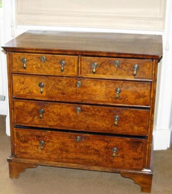 A mid 18thC walnut and burr walnut chest of drawers