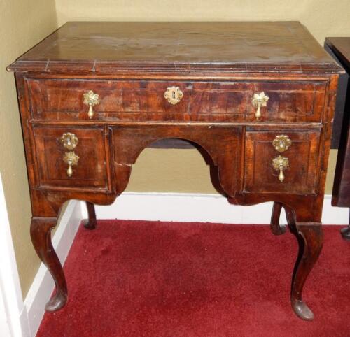 A walnut lowboy in mid-18thC style