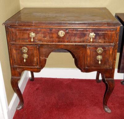 A walnut lowboy in mid-18thC style