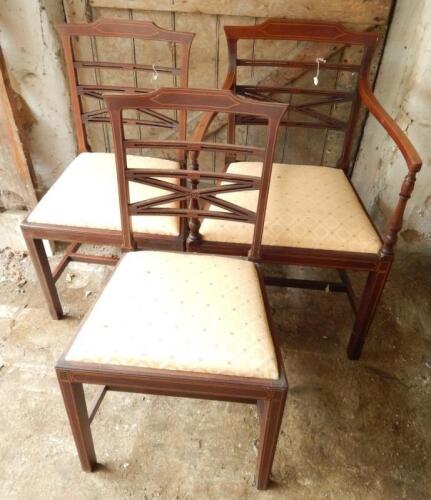 Three Sheraton string inlaid mahogany dining chairs