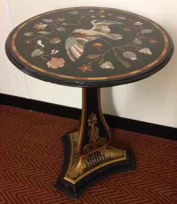 A parcel gilt and ebonised pedestal table