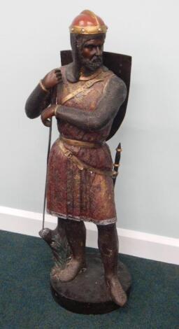 A 20thC cold painted bronze figure of a soldier wearing a helmet