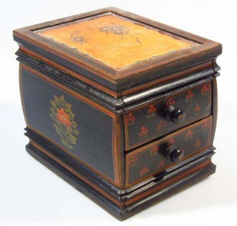 A painted wooden jewellery casket