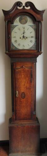 An early 19thC oak long cased clock