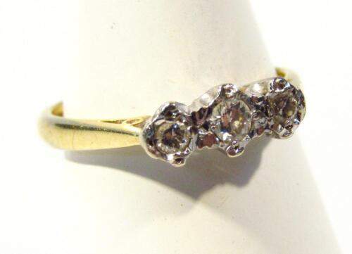 A ladies three stone diamond ring