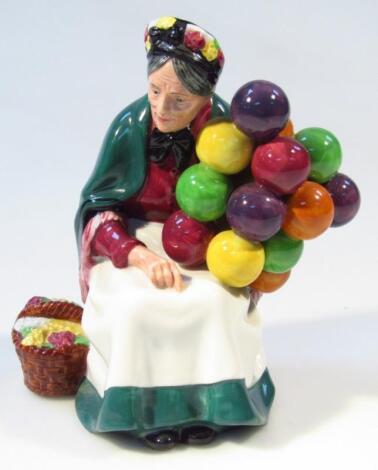 A Royal Doulton figure The Old Balloon Seller HN1515