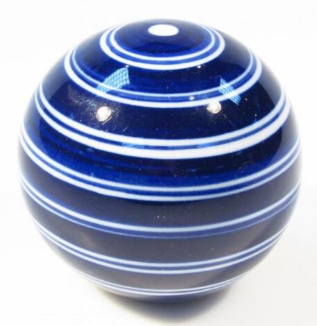 A late 19thC blue and white porcelain carpet bowl style paperweight