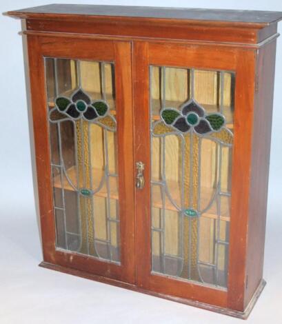 An Edwardian mahogany bookcase top