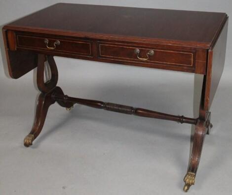 A 20thC mahogany sofa table