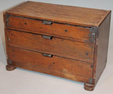 An early 20thC oak table cabinet