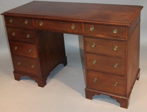 An early 20thC mahogany twin pedestal desk