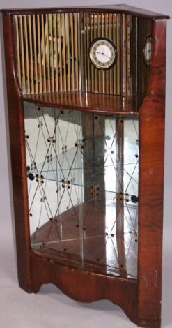 A mid-20thC walnut finish retro corner cabinet