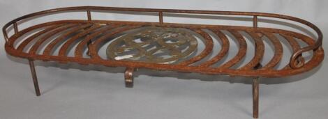 A late 19thC iron framed trivet