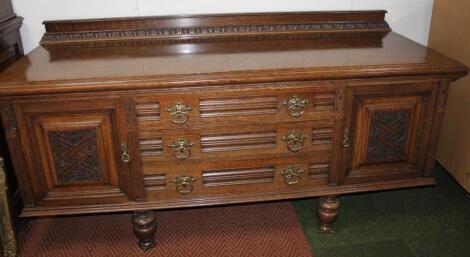 An Edwardian oak sideboard