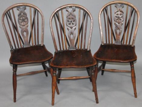 A set of three 19thC ash and elm wheel back chairs