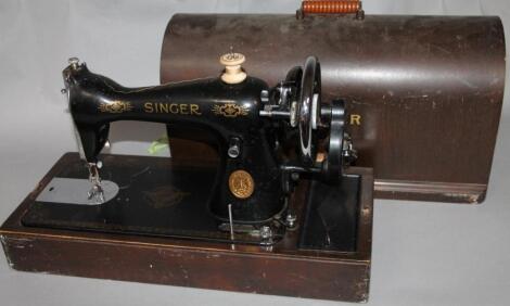 An early 20thC cased Singer sewing machine