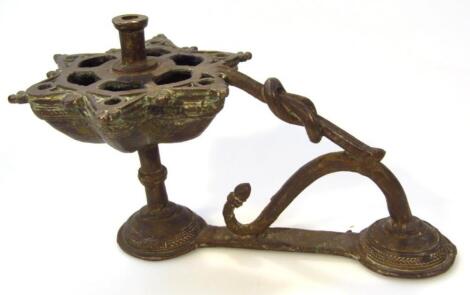 A Middle Eastern metal candlestick