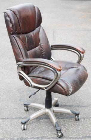 A modern retro design leather swivel office chair