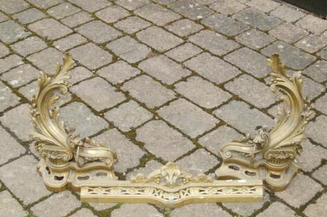 A 19thC French gilt brass fire fender