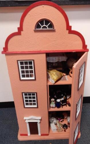 A Dutch style doll's house containing furniture