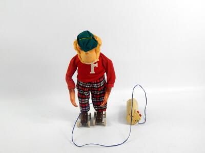 A 1960's battery operated remote control roller skating monkey