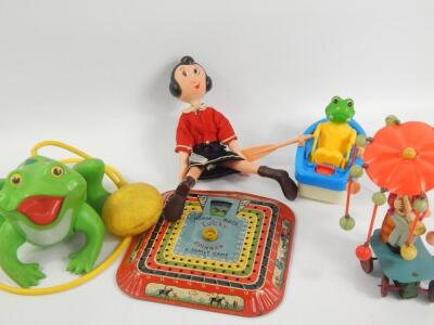 A collection of tin plate and other toys