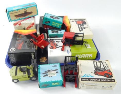 A small collection of die cast model forklift trucks by Gama and Linde