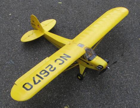 A polystyrene Piper Cub single propeller remote controlled airplane