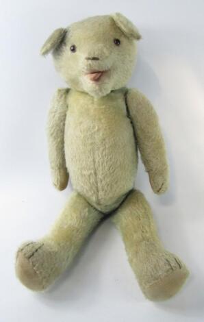 A mid 20thC blonde plush teddy bear