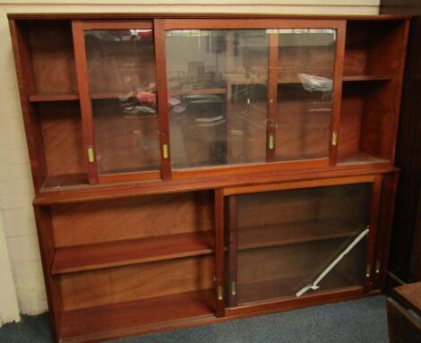 A pair of teak library bookcase