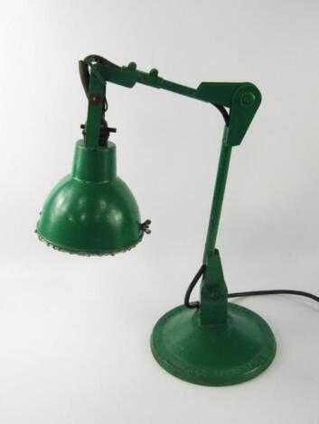 A green painted cast iron anglepoise lamp