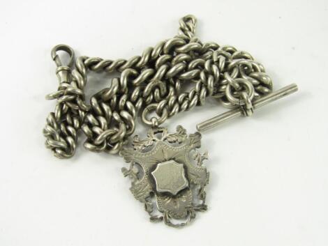 A silver curb link Albert chain