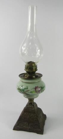 A Continental late 19thC cast iron oil lamp