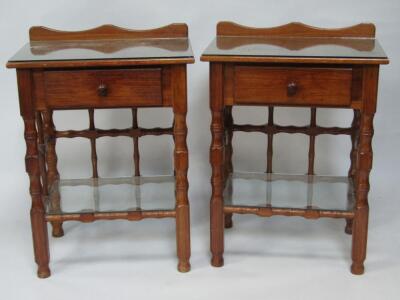 A pair of Victorian style hardwood bedside tables