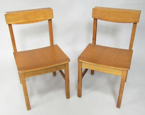 A pair of oak church chairs