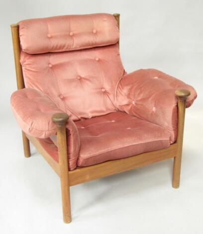 A 1970's teak framed armchair