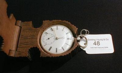 A silver open face pocket watch