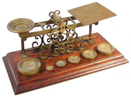 An early 20thC oak and brass table scale