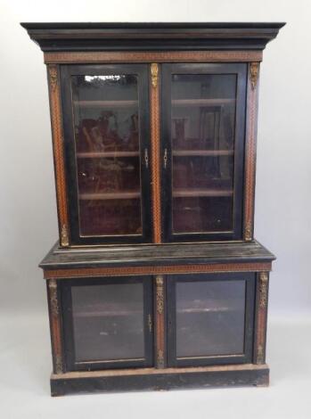 A Victorian and ebonised and parquetry bookcase