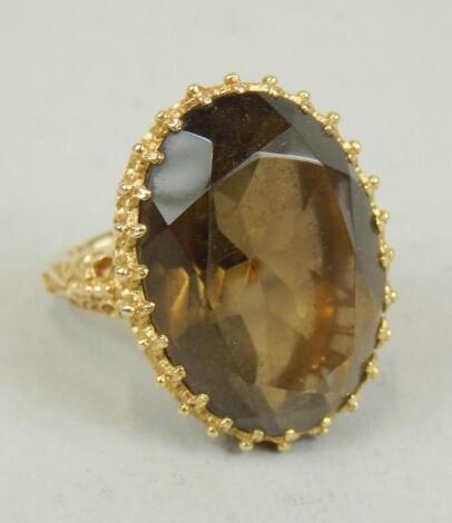 A 9ct gold smokey quartz set dress ring