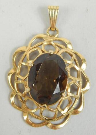 A 9ct gold filigree and smokey quartz pendant