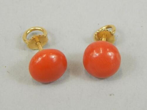 A pair of coral bead stud earrings