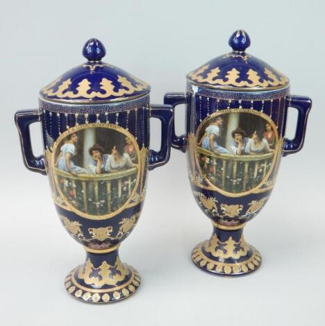 A pair of 20thC Vienna style two handled vases and covers