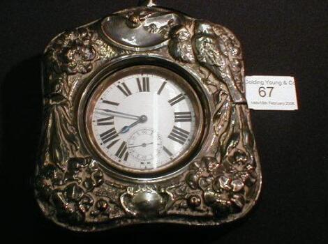 A semi Goliath open face pocket watch in an Art Nouveau sculptured travel case