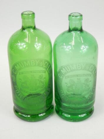 Two green glass bottles