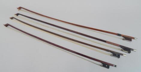 Four various violin bows