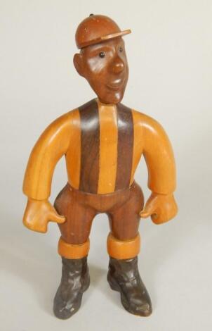 An unusual wooden carving in the form of a jockey