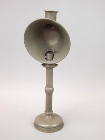 A Victorian pewter candlestick with shade