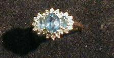 An 18ct gold ladies aquamarine set dress ring